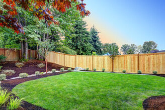 Picturesque photo of wood fence surrounding a residential yard in Markham, Ontario.
